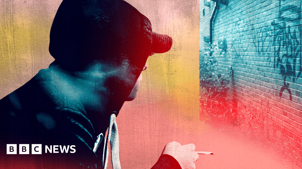 Montage of an anonymous young man in hoodie and cap smoking a roll-up while looking away from the camera towards a graffiti'd wall