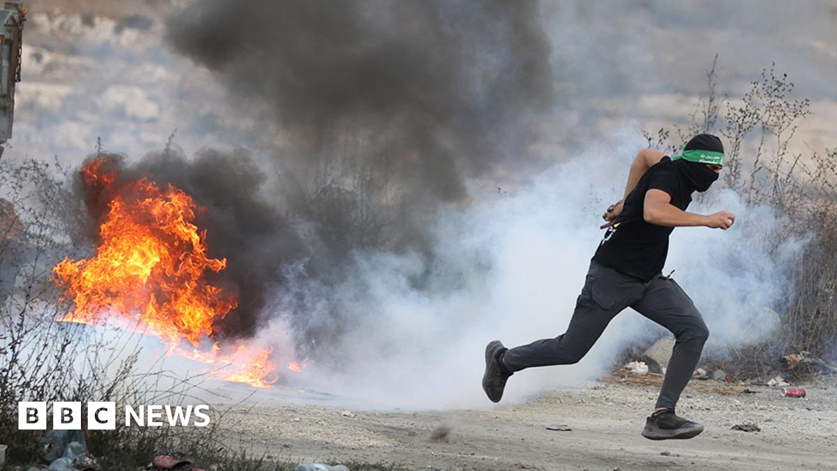 Palestinians burn car tires and block roads as they clash with Israeli forces in Beit El district of Ramallah, West Bank on October 07, 2023