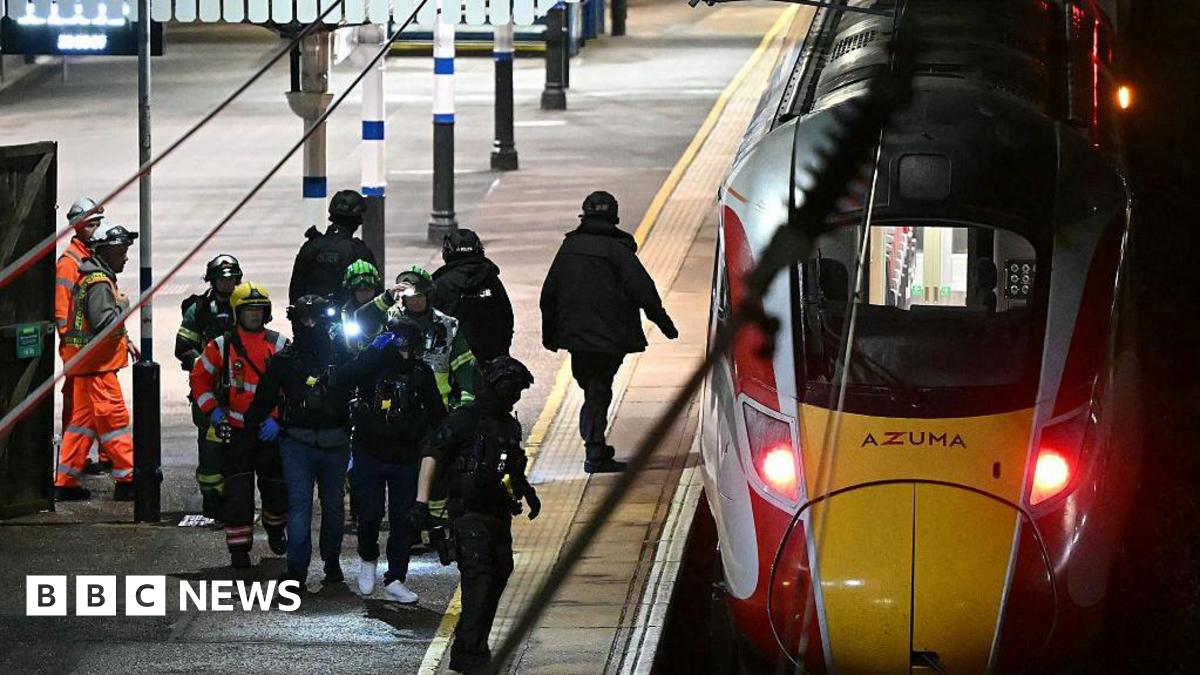Emergency services next to a train.