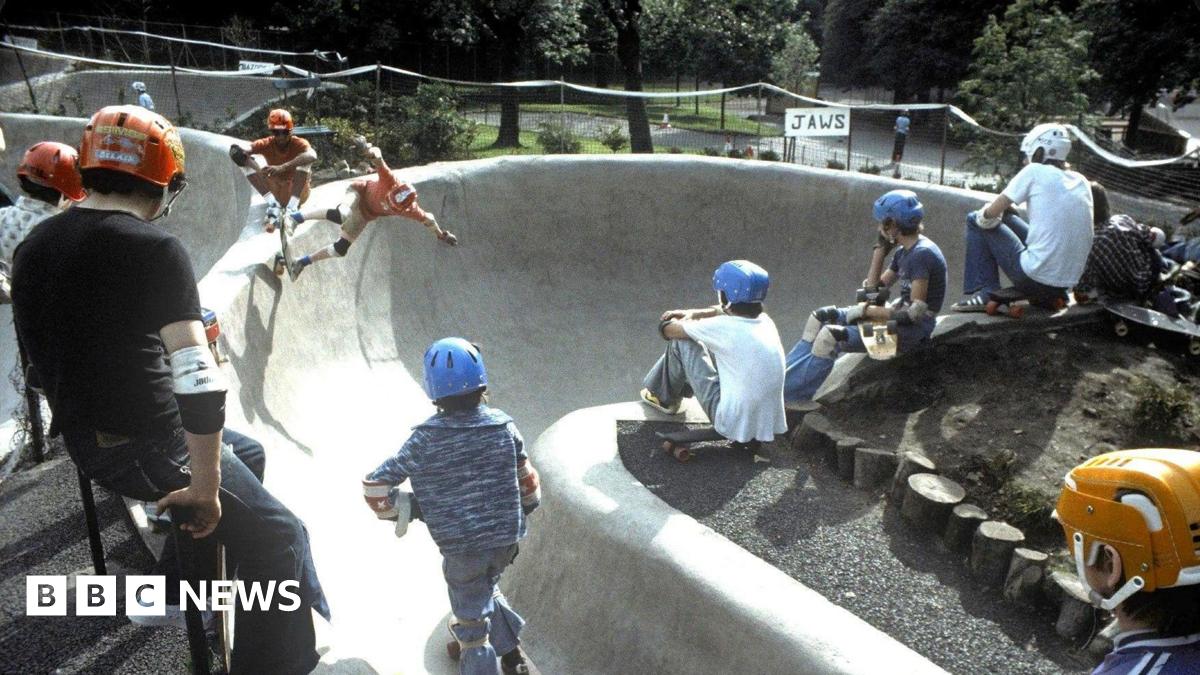 Young people in 1978 wearing helmets and other safety gear skateboarding at Kelvin Wheelies skatepark 