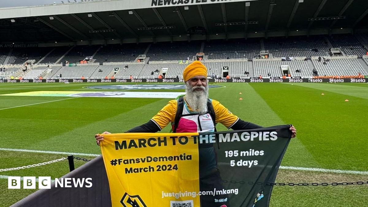 Wolves fundraiser completes 195-mile walk to football game - BBC News