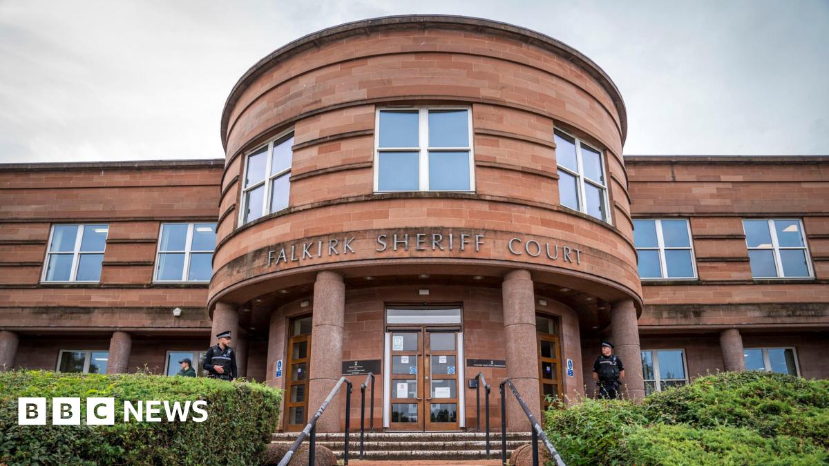 Falkirk Sheriff Court. A brown building with a round entrance.