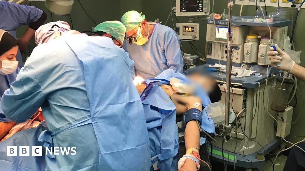 Image supplied by Dr Perlmutter shows medics operating on a wounded Palestinian in Gaza