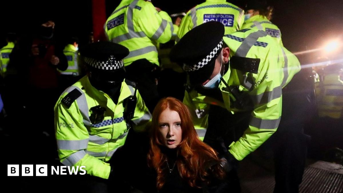 Police at Clapham Common handcuff a woman