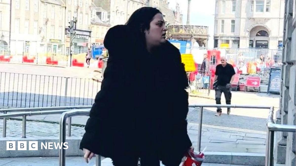 Courtney Gartshore, dressed in black, arrives at the High Court in Aberdeen.