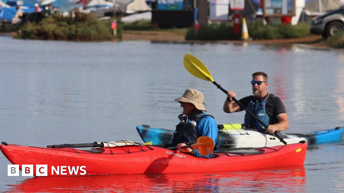 Kayakers on a car park
