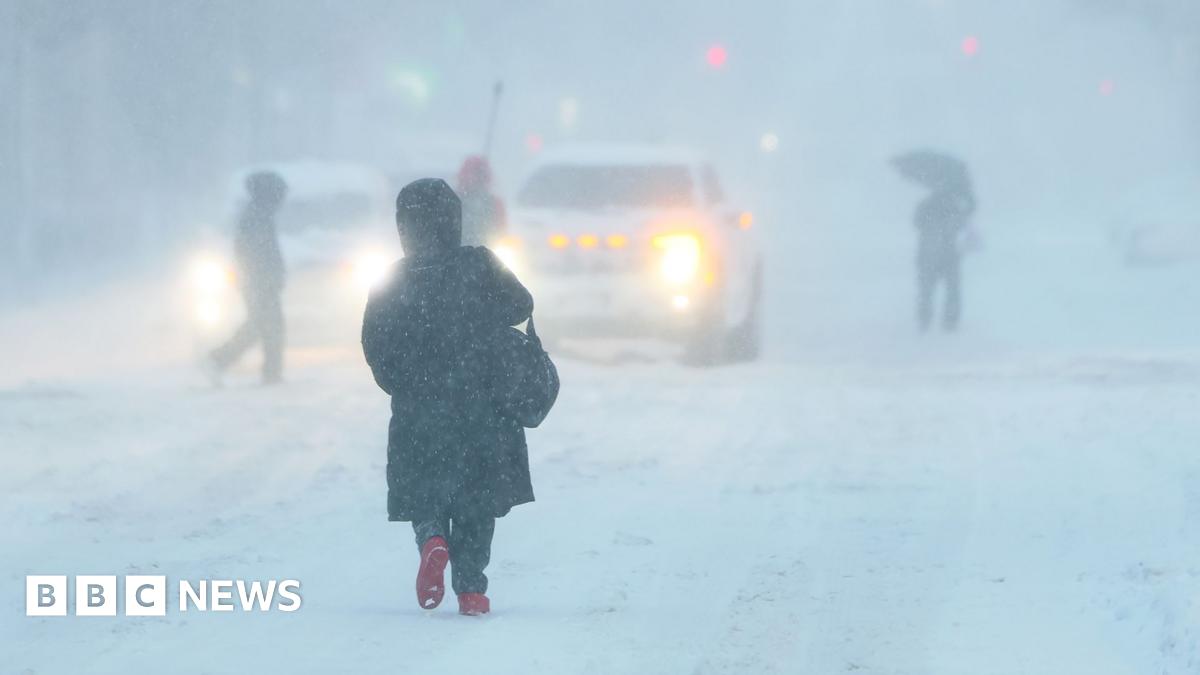 Across the US, hundreds of thousands of homes and businesses are without power - while New York City bans non-essential travel.