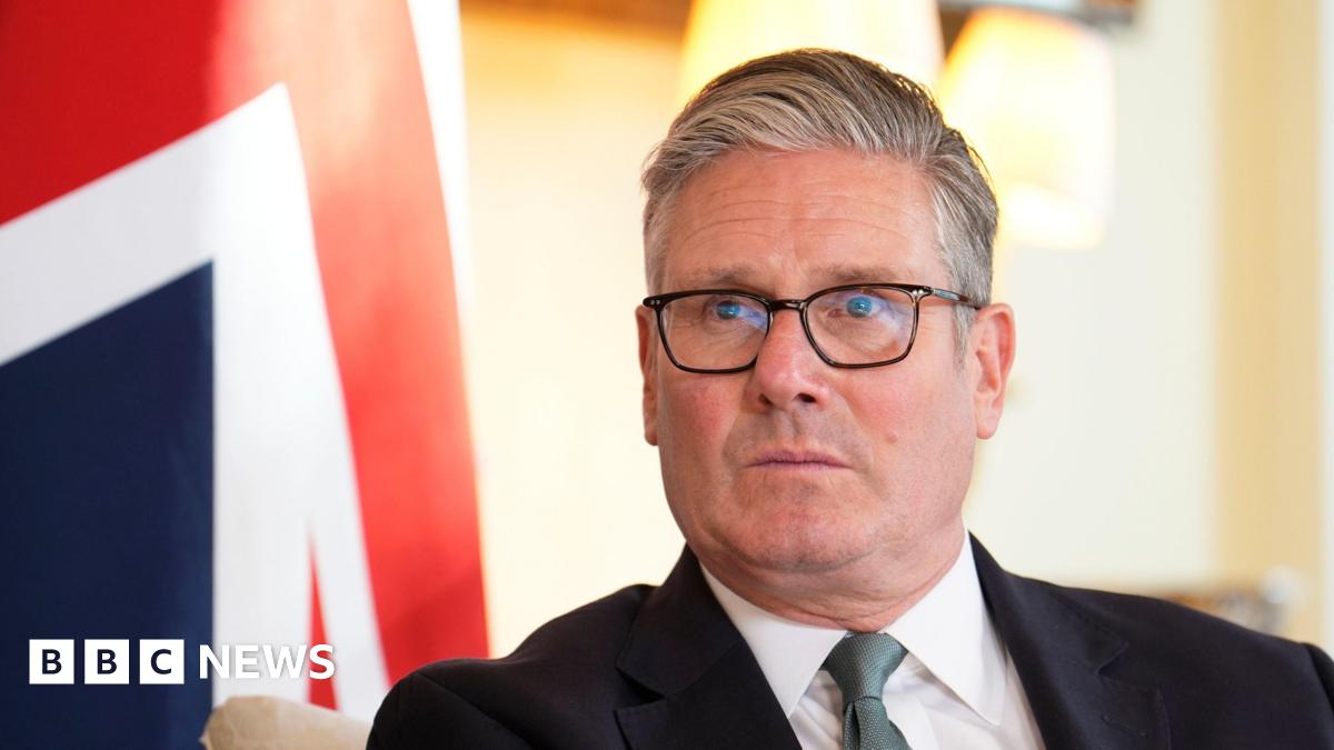 A headshot of Keir Starmer with a Union Jack in the background.