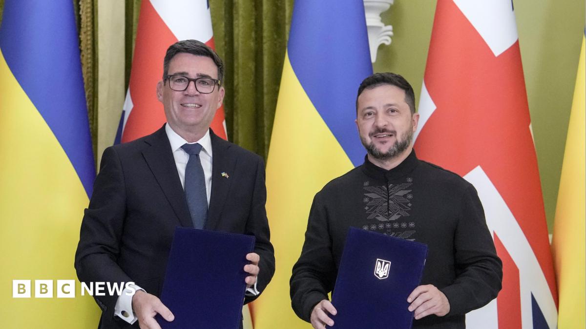 Photo: bbc.co.uk Ukrainian President Volodymyr Zelensky (R) and Prime Minister of Britain Andy Burnham (L) pose as they attend a signing