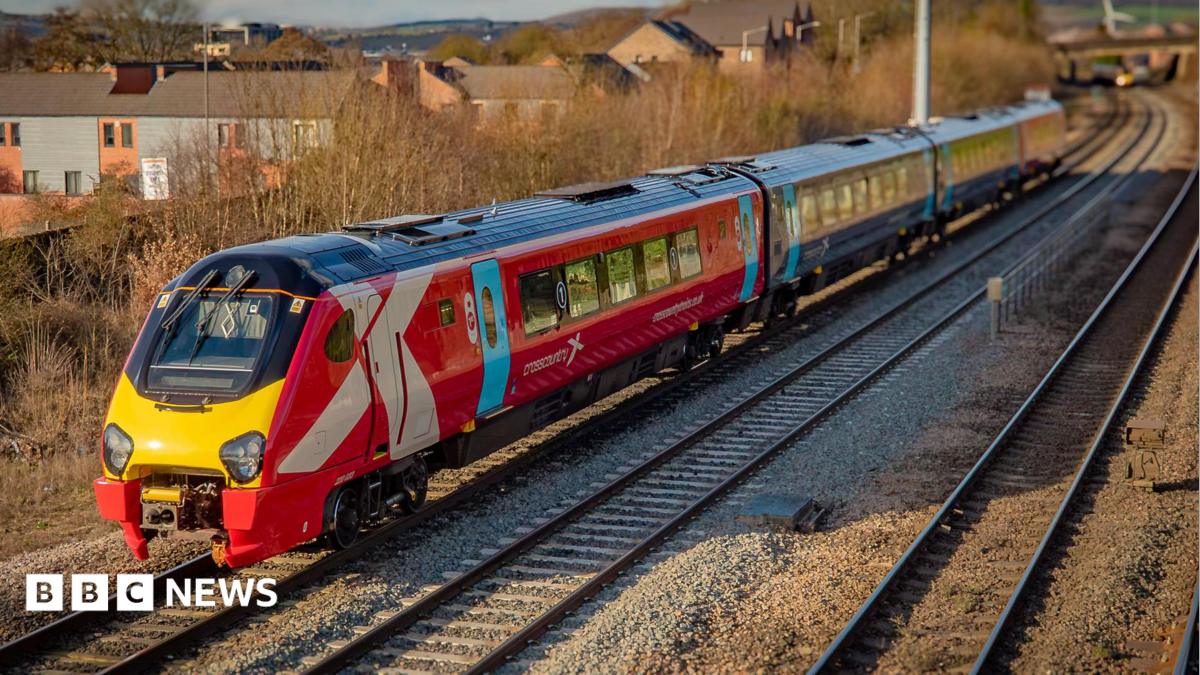 Photo: bbc.co.uk The cab and first carriage of a CrossCountry train travels on tracks in the countryside. In the background trees and houses