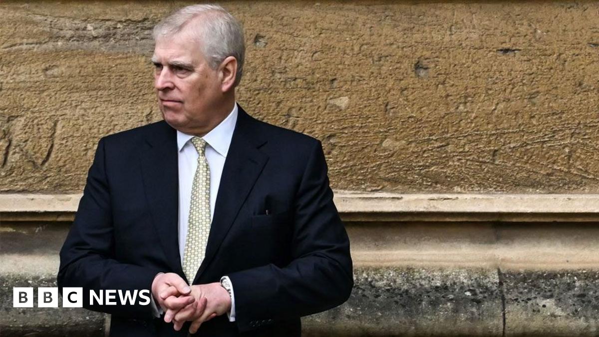 Picture shows Prince Andrew, wearing a dark suit, looking to the side
