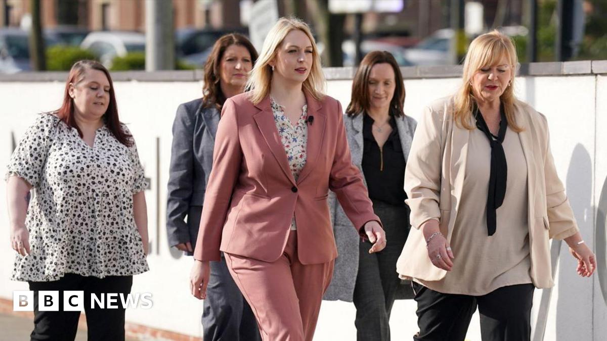 Five of the eight nurses arriving at Newcastle Tribunal Service. They are wearing smart clothes. Two of the nurses are blonde and walking ahead of their three colleagues.