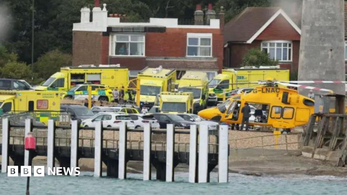 Photo: bbc.co.uk ambulances and a helicopter lined up by the shore