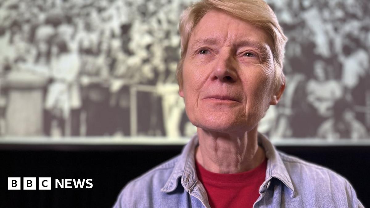 Shân Veillard-Thomas looks wistfully away from the camera remembering pride