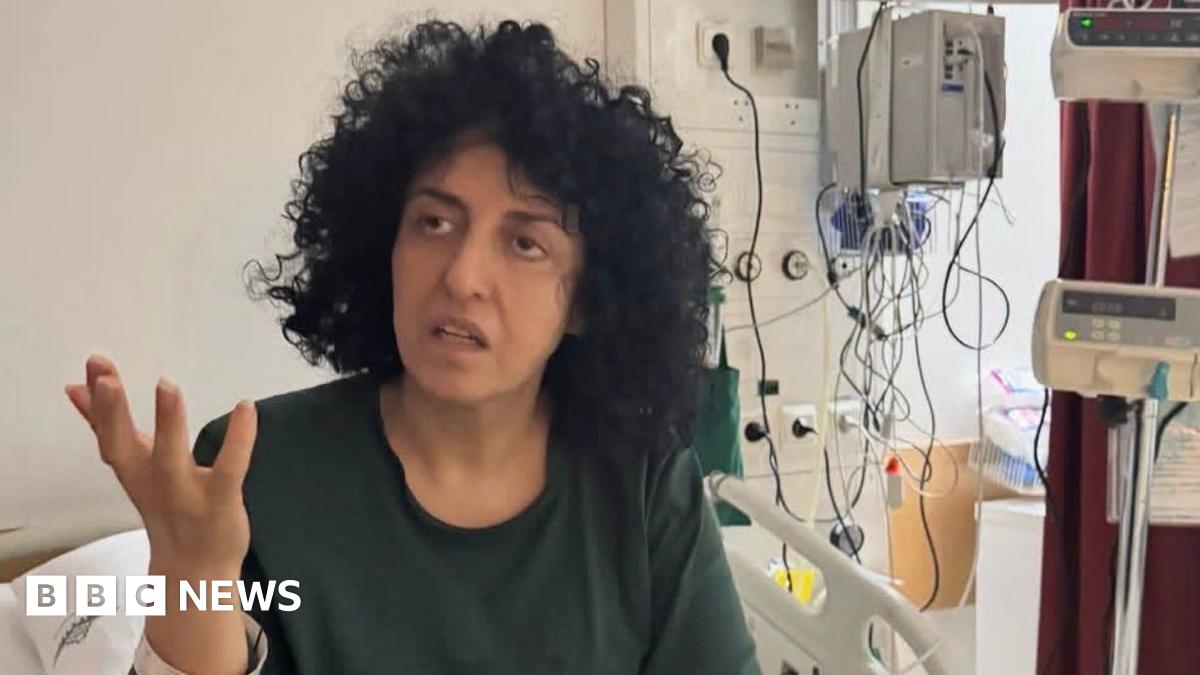 An undated photograph posted by lawyer Chirinne Ardakani showing Iranian Nobel Prize-winning human rights activist Narges Mohammadi gesturing from a hospital bed in Iran (10 May 2026)