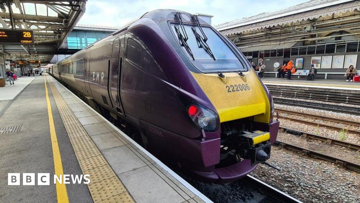 An East Midlands Railway train stopped at a Sheffield station.