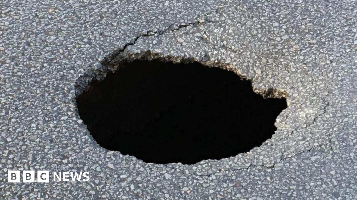 Sinkhole up to 20ft deep leads to Neath road closure - BBC News