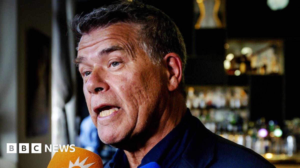Emile Ratelband, 69, speaks with the press in a bar in Amsterdam
