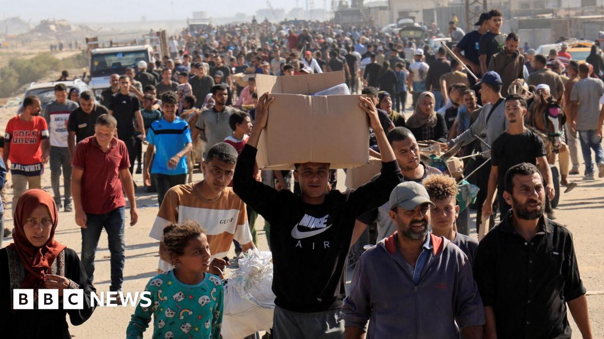 Palestinians seeking aid gather near an aid distribution site run by the US-backed Gaza Humanitarian Foundation, in Rafah, in the southern Gaza Strip (27 November 2025)