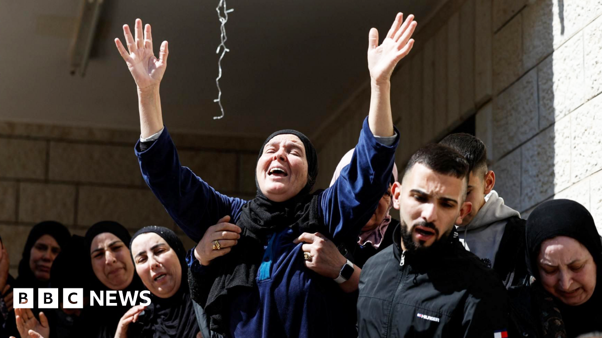 A mourner reacts during the funeral of three Palestinians killed during an attack by Israeli settlers in the village of Abu Falah, near Ramallah, in the Israeli-occupied West Bank (9 March 2026)