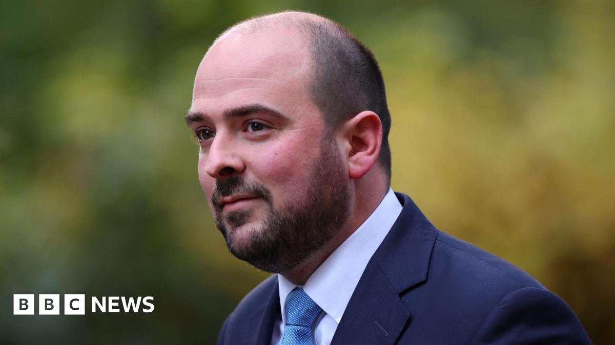 Conservative MP Richard Holden, wearing a suit and blue tie