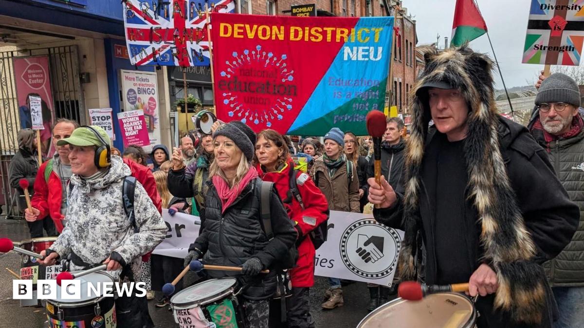 Protest groups come together 'peacefully' in Exeter city centre - BBC News