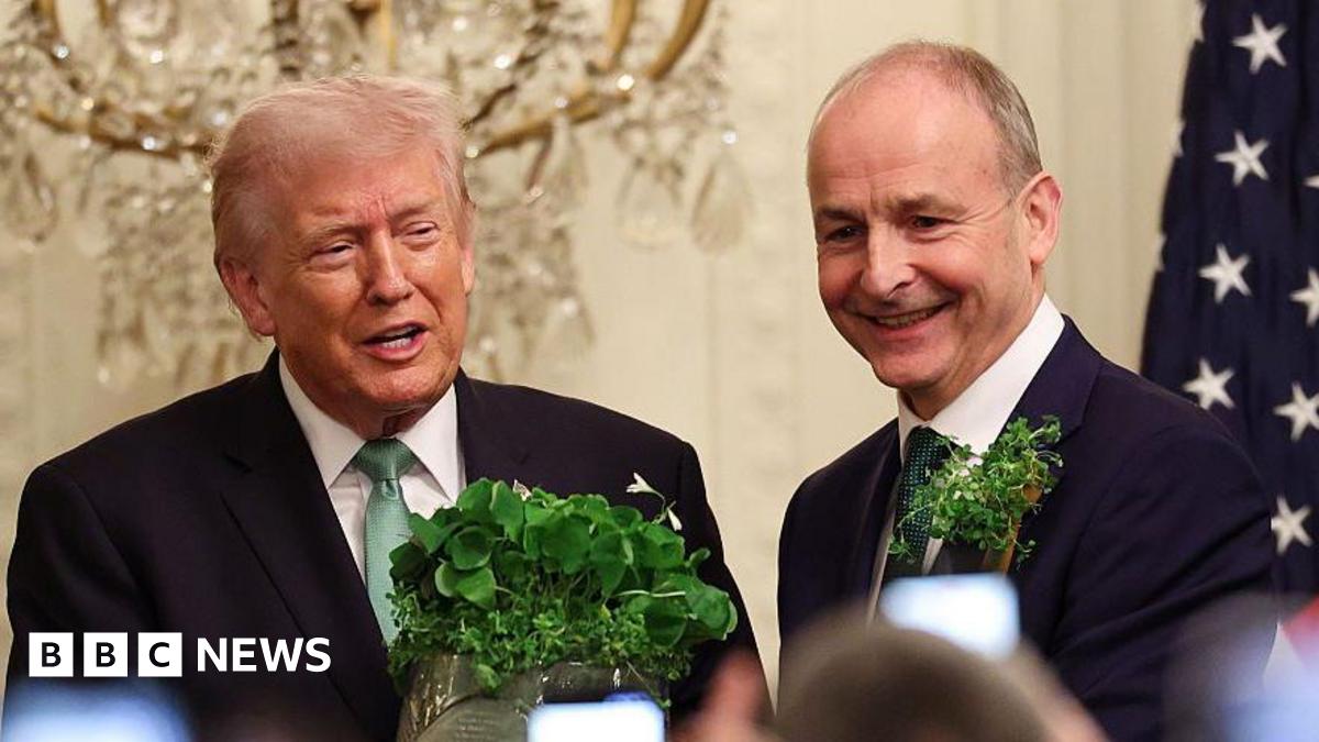 President Donald Trump receives a bowl of shamrocks from Taoiseach of Ireland Micheál Martin (R) during a St. Patrick’s Day event in the East Room of the White House on March 17, 2026 in Washington, DC.