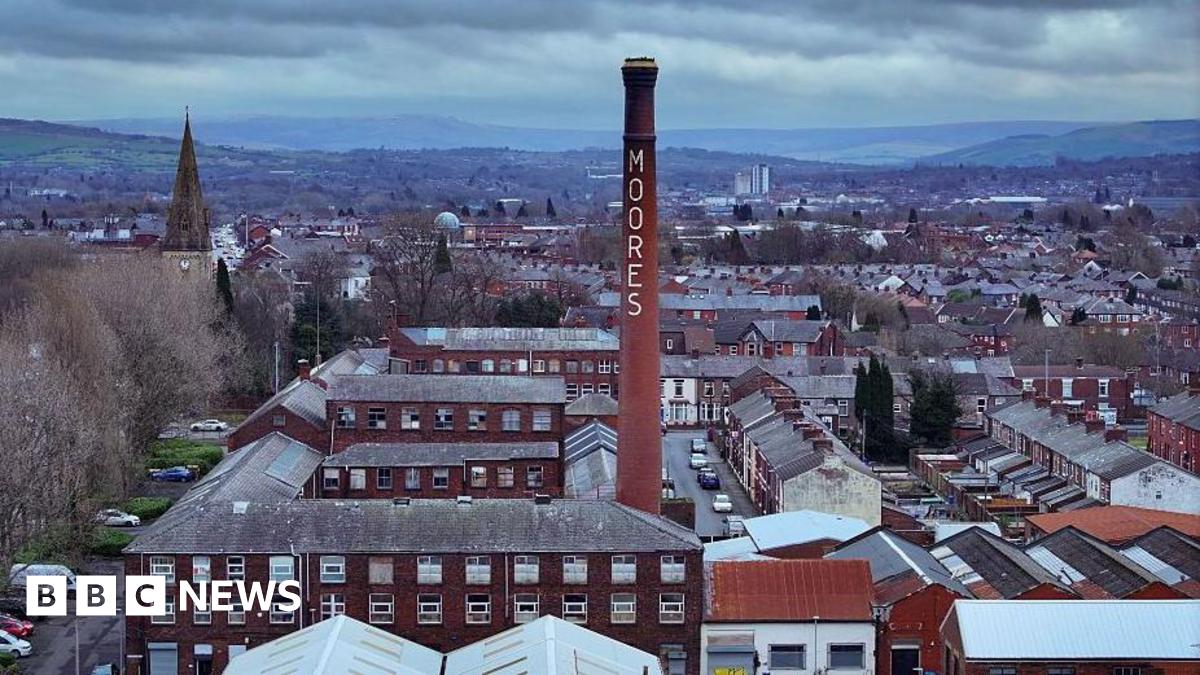 An aerial view of the historic Moores Hat Factory and homes in Denton on February 18, 2026 in Manchester, United Kingdom