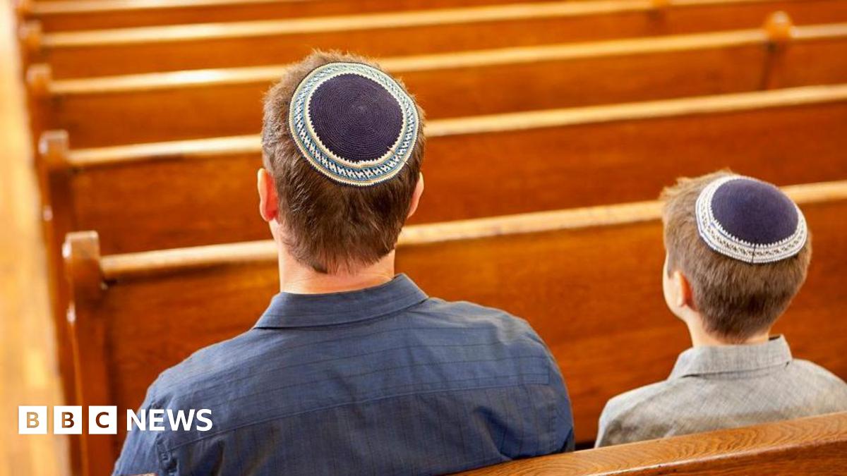 Two people in a synagogue