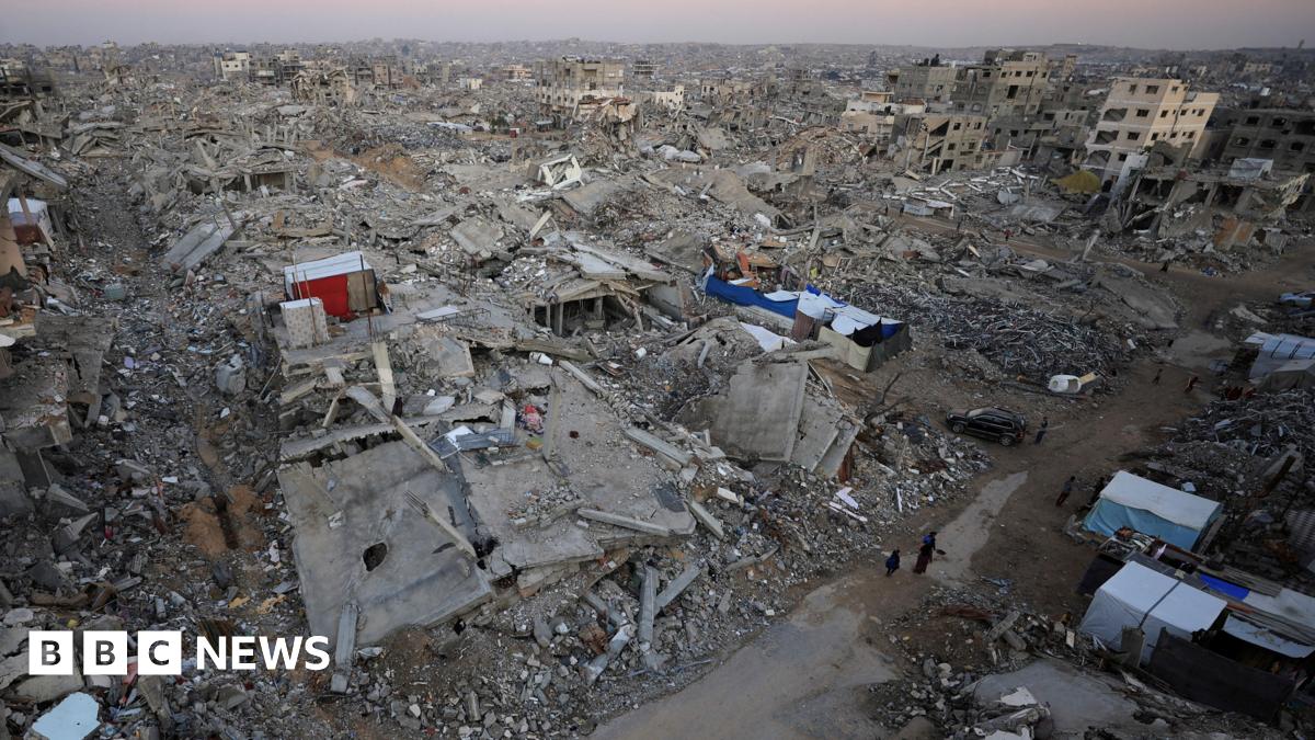 Long shot of Gaza rubble and demolished homes, bricks and concrete burying roads