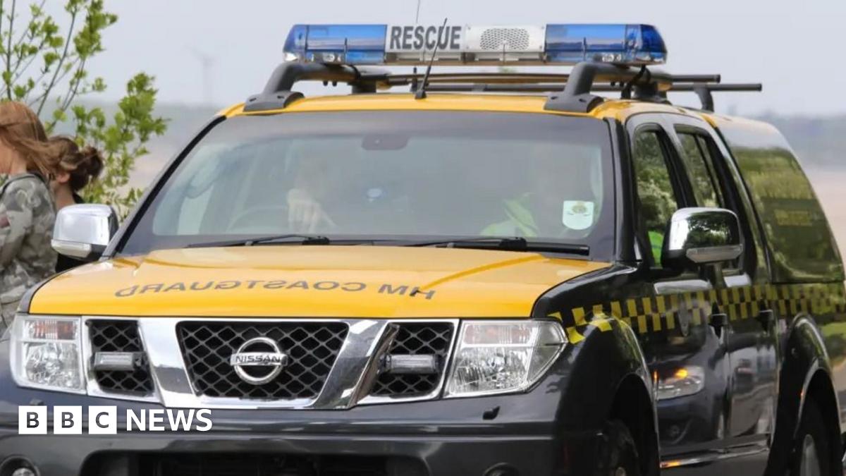 Two people rescued from Isle of Wight landslide - BBC News