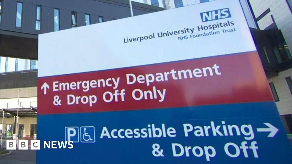 A close-up of a hospital sign which reads 'NHS Liverpool University Hospitals NHS Foundation Trust'. It also directs people to the A and E department, as well as an accessible parking drop-off area.