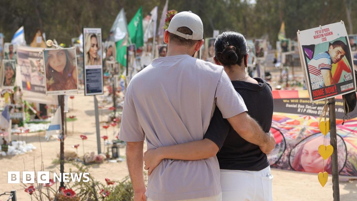 People visit the memorial site for the victims of the 7 October 2023 attack on the Nova music festival, near Kibbutz Re'im, southern Israel (6 October 2024)