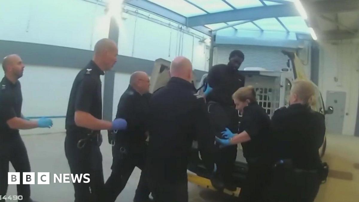 Killer kicked officer at police station, inquiry shown