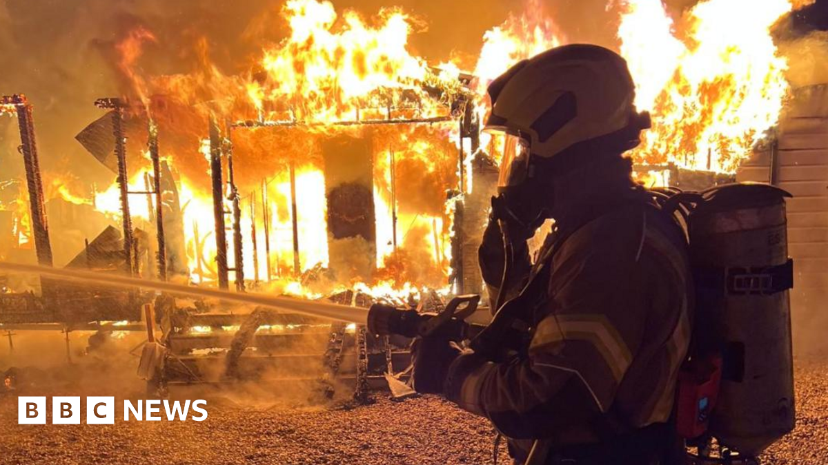 Essex and Hertfordshire fire crews tackle Roydon caravans blaze - BBC News