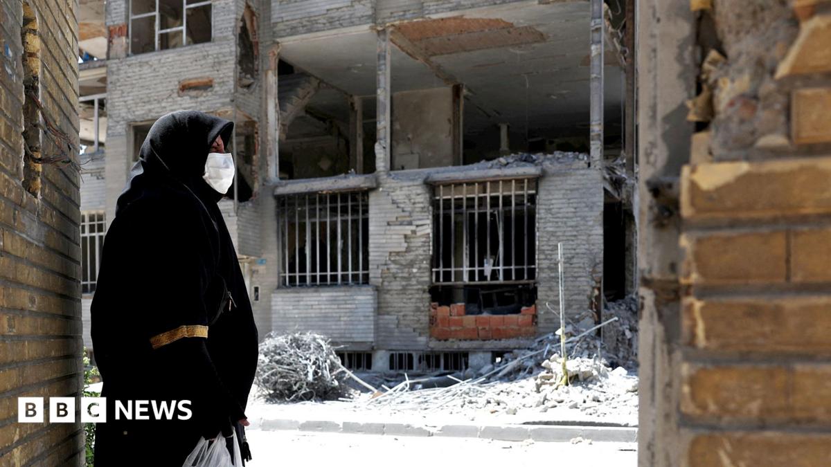 A woman looks at the rubble of her house, which was damaged in a U.S. and Israeli strike in March, in Tehran, Iran June 7, 2026