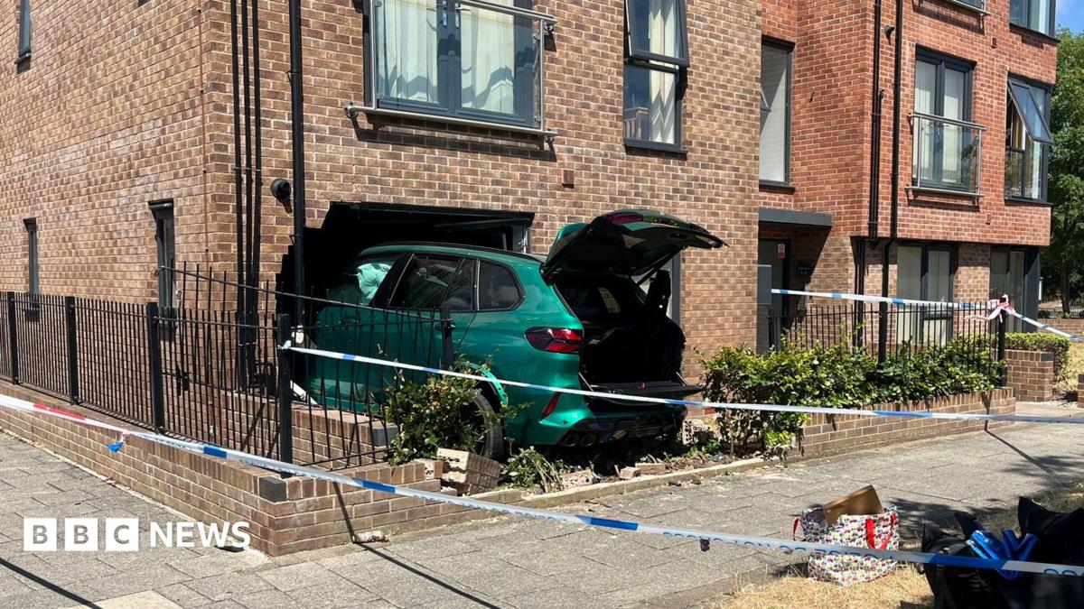 Police cordon after car crashes into apartments in Nottingham
