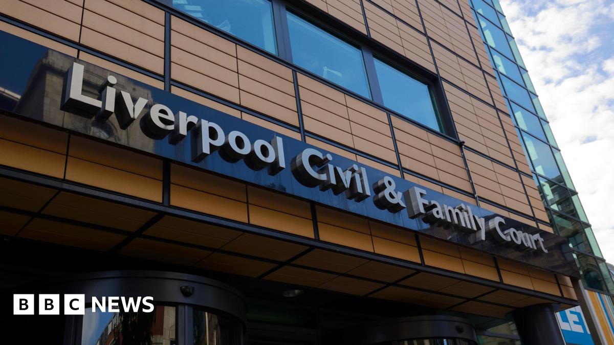 A tall brown building with the lettering "Liverpool Civil & Family Court"