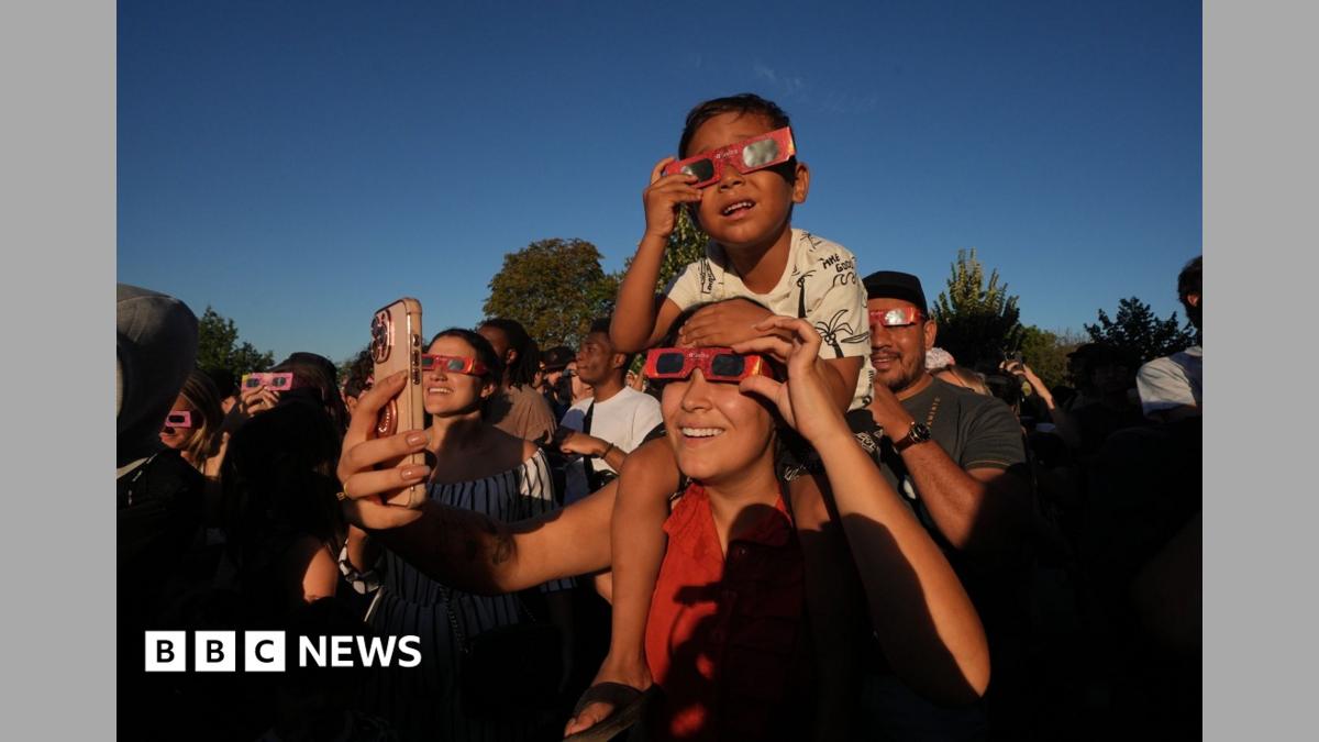 Crowds fill London's parks to watch the partial solar eclipse