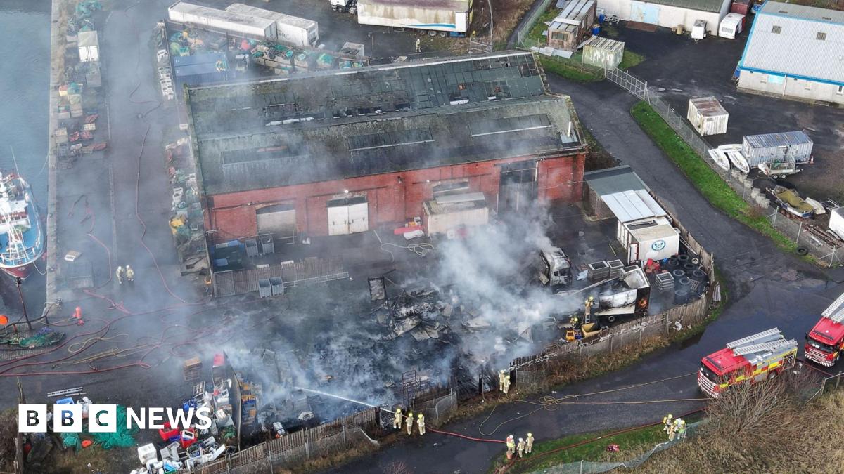HGVs destroyed after fire breaks out at Methil harbour - BBC News