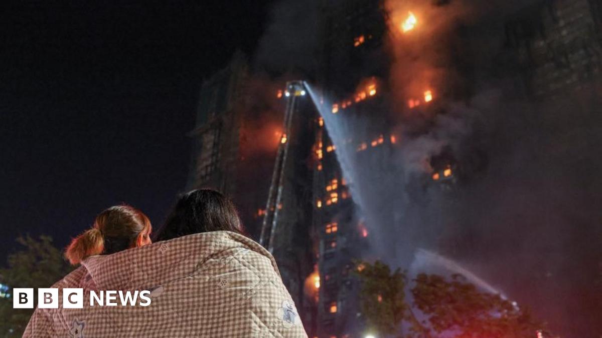 
                            'Hang in there': Agonising wait for hundreds missing after Hong Kong blaze