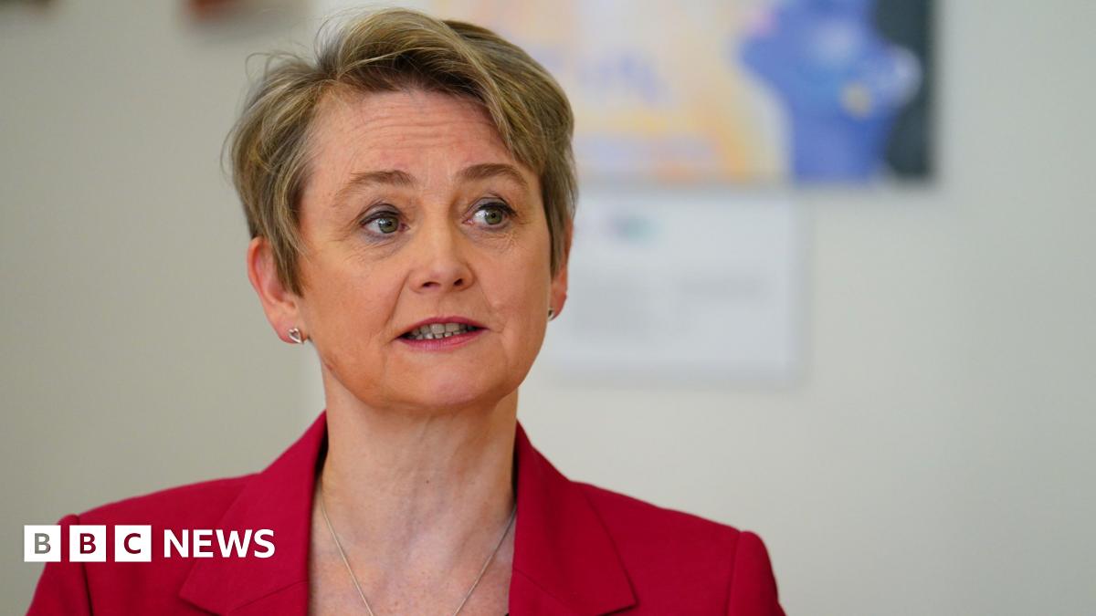Home Secretary Yvette Cooper wearing a red suit