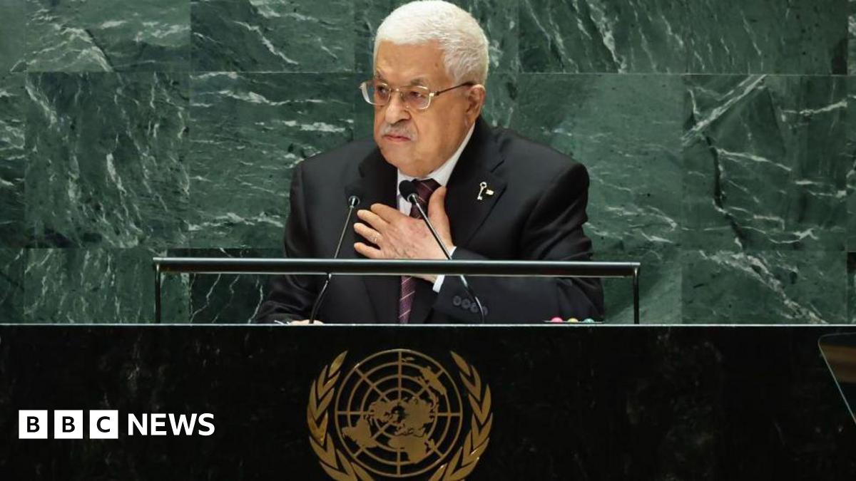 Picture shows Mahmoud Abbas - an older man with white hair, glasses and a greying moustache dressed in a suit and tie - speaking at the United Nations General Assembly in New York. He is standing behind a desk that bears the UN logo.