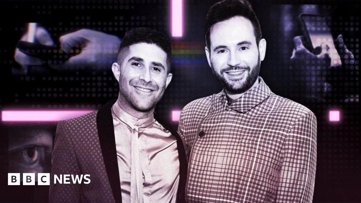 Benjamin Cohen and husband Anthony James posing for a picture in smart shirts and jackets. 