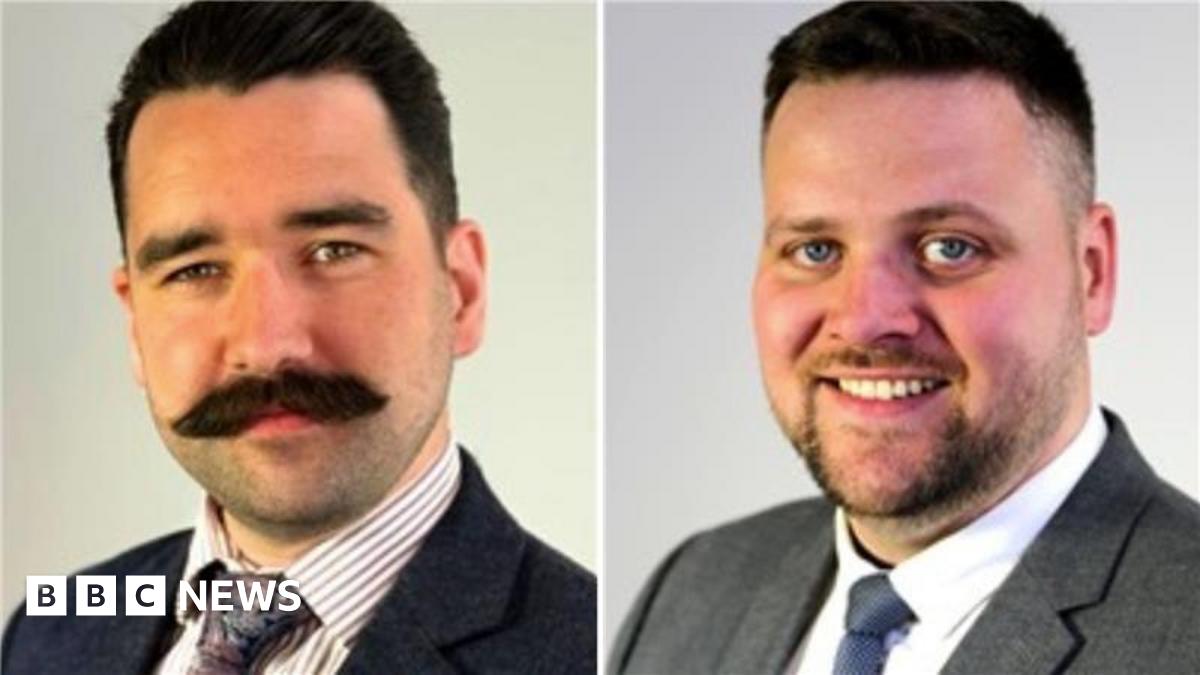 Headshots of Councillor Scott Cameron and Councillor Luke Cooper. Councillor Cooper has a large black moustache and is wearing a dark suit jacket, white shirt and tie. Councillor Cameron has a thin beard and wears a blue tie, grey jacket and white shir...