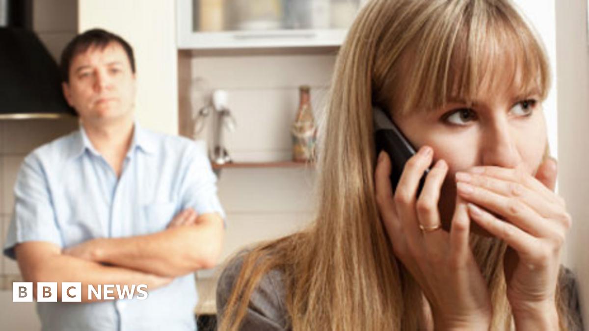 Woman secretly talking on phone