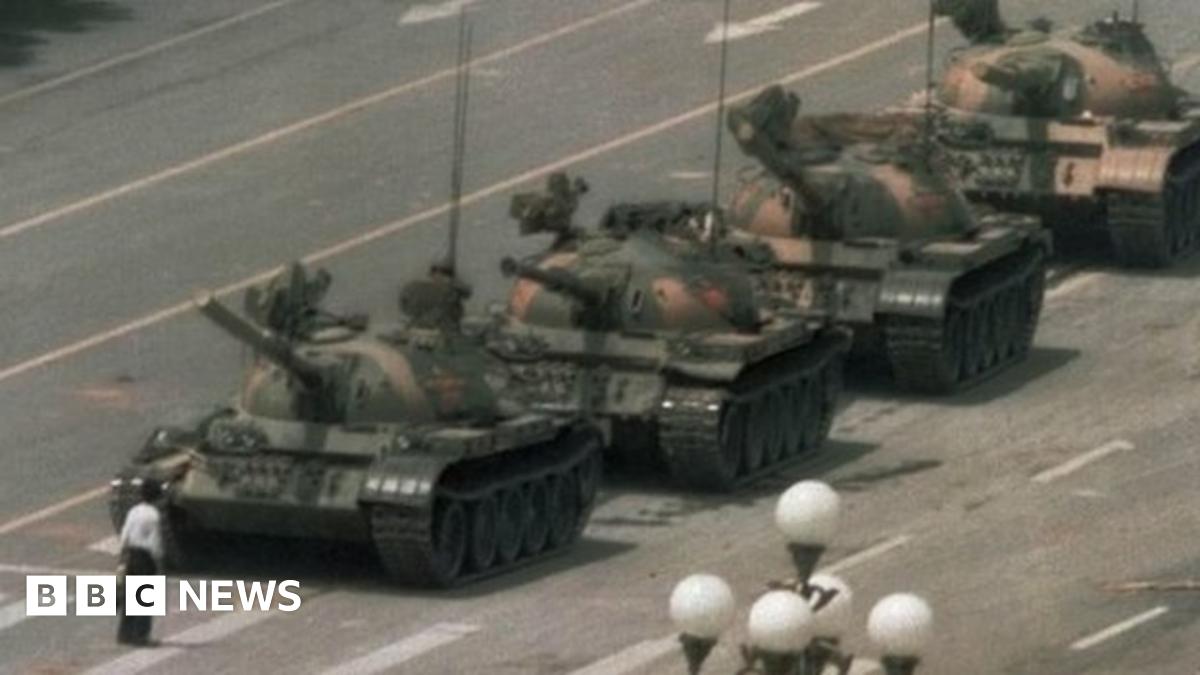 A man tries to block tanks near Tiananmen Square in Beijing. Photo: 5 June 2014