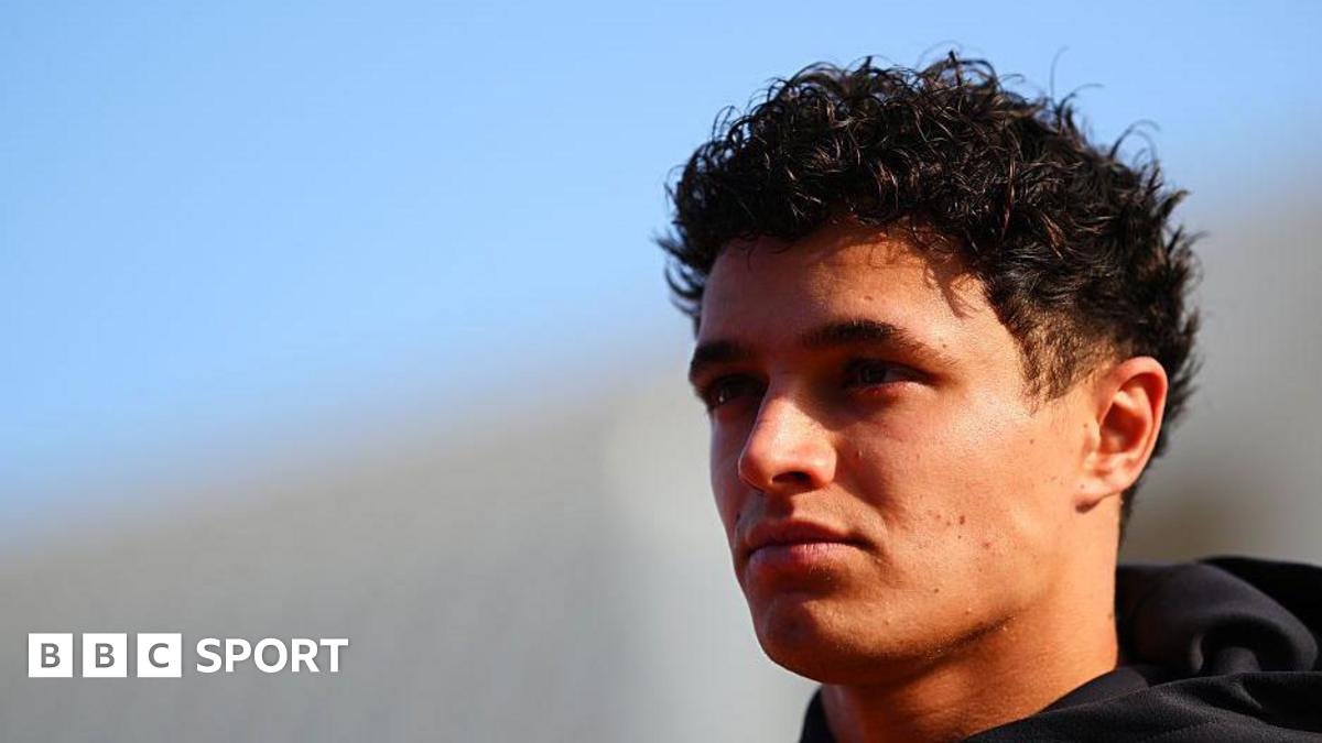 Formula 1 cars racing under the floodlights at the Qatar Grand Prix