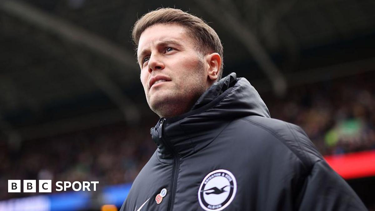 Brighton and West Ham players competing for the ball in a Premier League match
