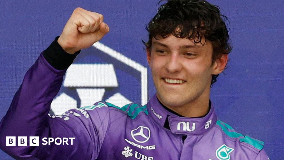 Kimi Antonelli clenches his fist in celebration on the podium after winning the Miami Grand Prix
